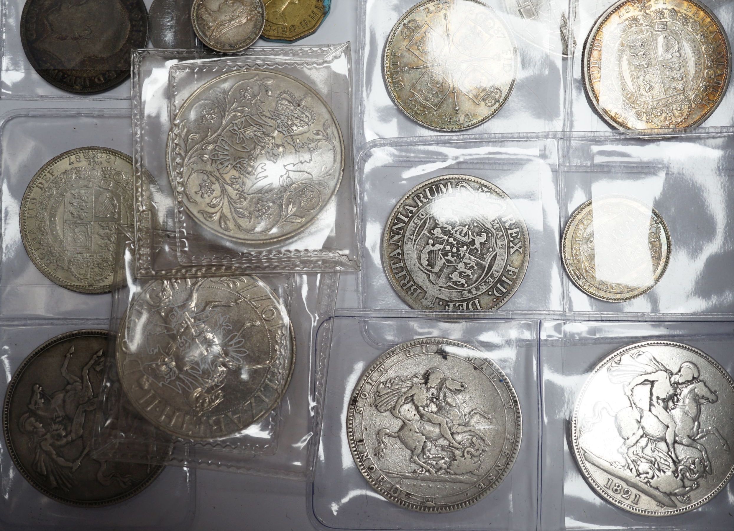 A group of UK coins including 1819, 1821 and 1891 crowns, two 1887 half crowns, 1887 florin, etc.